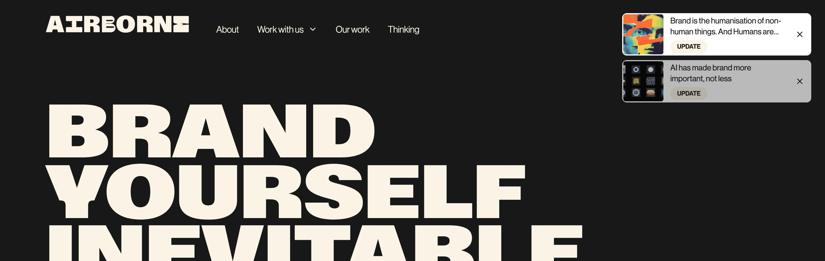 Massive high-contrast typography commands a dark canvas punctuated by minimalist floating update cards.