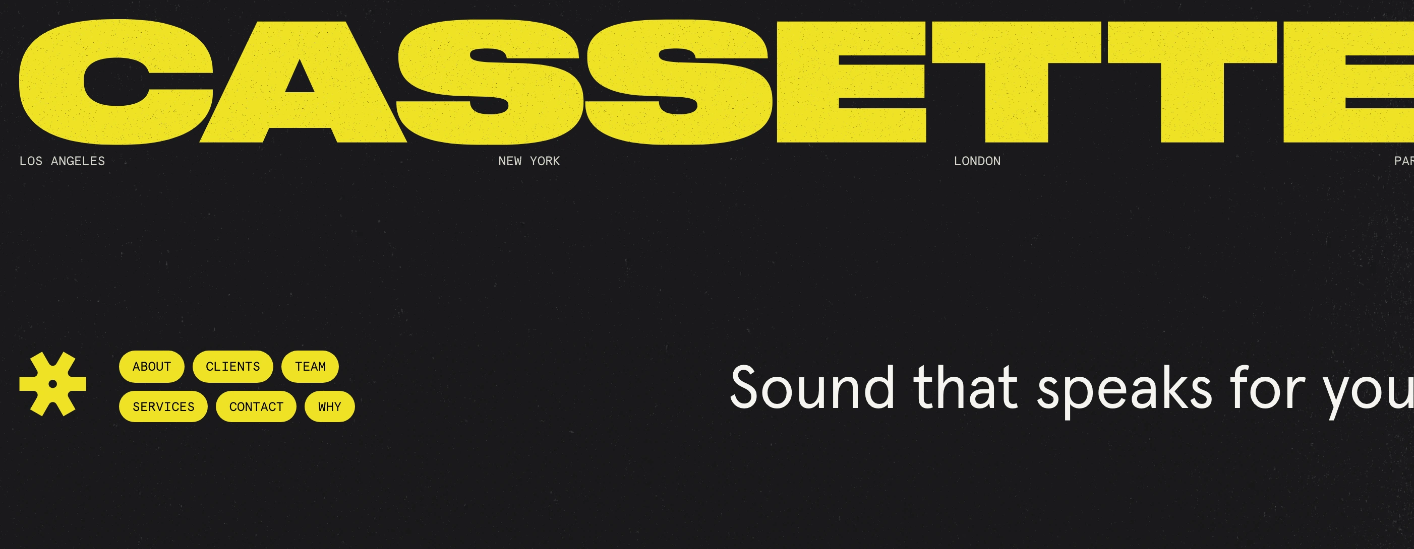 Punchy dark hero anchored by a massive acid-yellow wordmark and asymmetric tactile pill navigation.