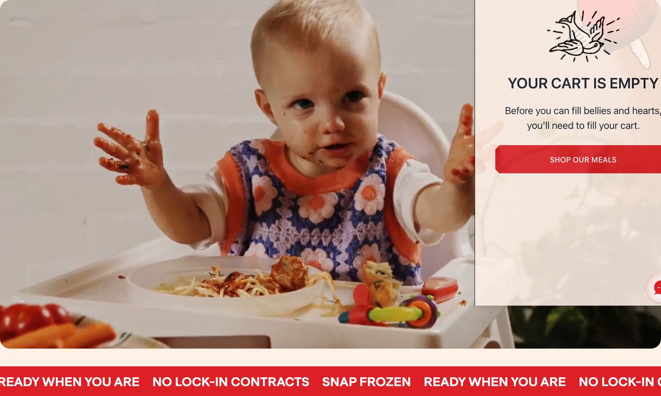 Warm and playful baby mealtime hero with an open cart drawer and an energetic red scrolling ticker bar.