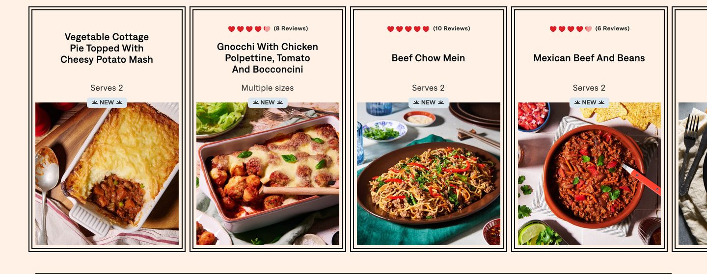 Warm and appetizing product carousel framing comforting home-cooked meals inside classic outlined cards.