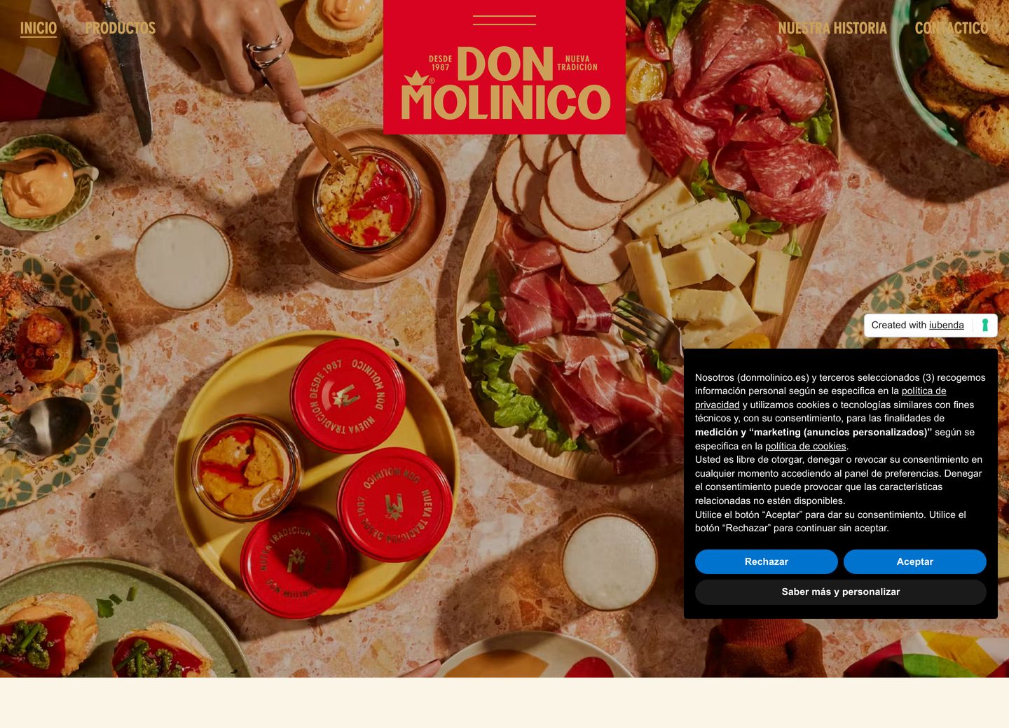 Rich, convivial Spanish dining spread captured from above and anchored by bold red traditional branding.