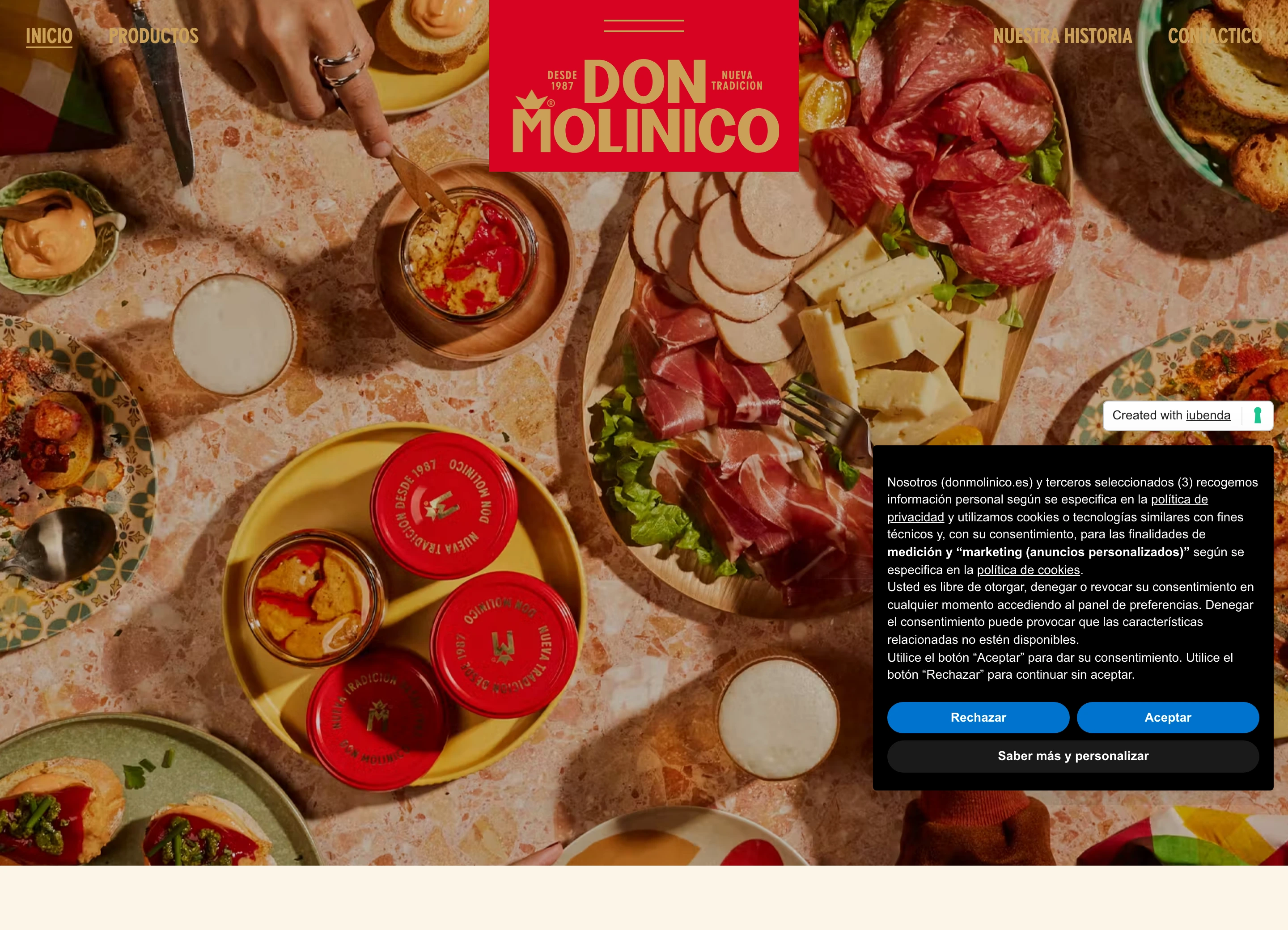 Rich, convivial Spanish dining spread captured from above and anchored by bold red traditional branding.