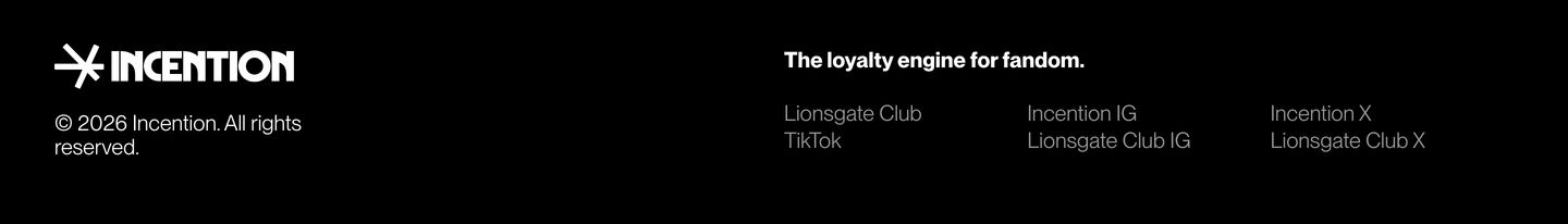 A stark black footer with crisp monochrome typography, balancing a heavy logo against lightweight multi-column links.