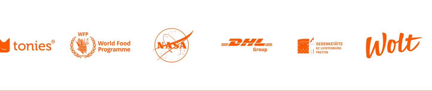 A vibrant monochrome logo bar uniting diverse global partner marks in a single punchy orange tint across clean white space.