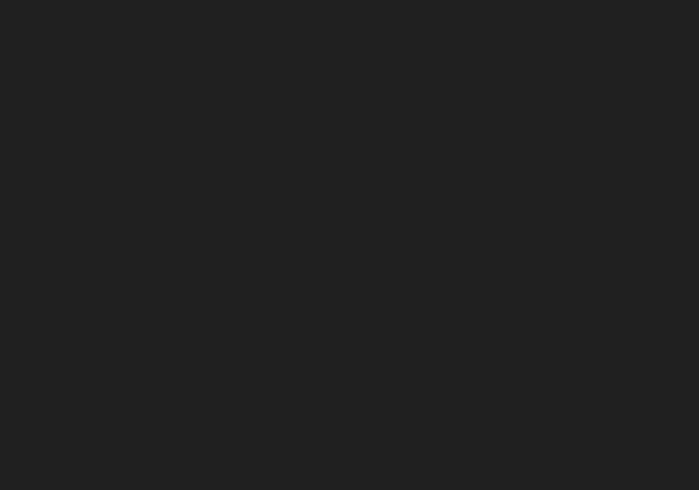 An expansive dark grey video backdrop setting a quiet, cinematic stage without typography.
