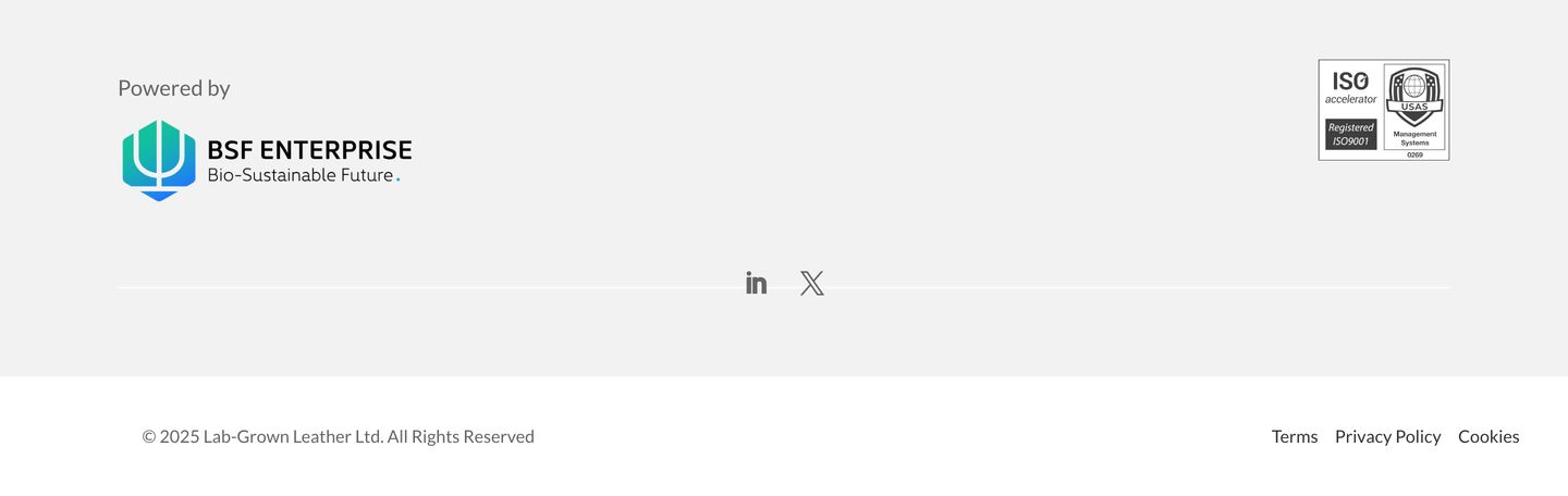 A sparse, clinical corporate footer featuring institutional certification badges and ample neutral grey whitespace.