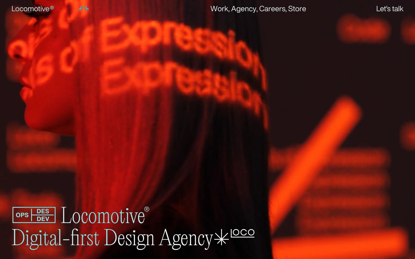Immersive dark hero anchored by glowing red projection mapping and refined editorial typography pinned to the lower grid.