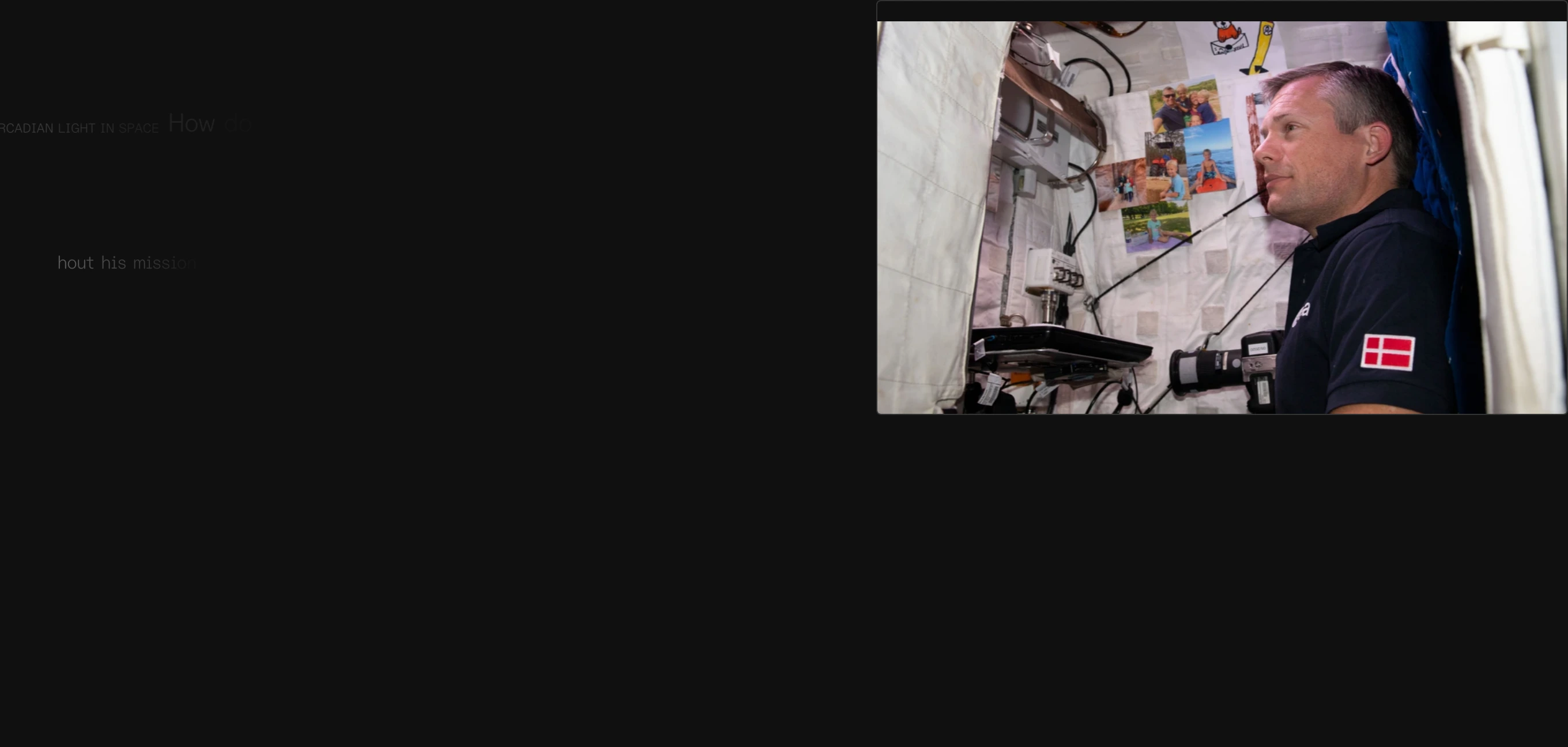 Subdued and atmospheric dark section pairing ghostly low-contrast typography with an intimate documentary window into a spacecraft cabin.