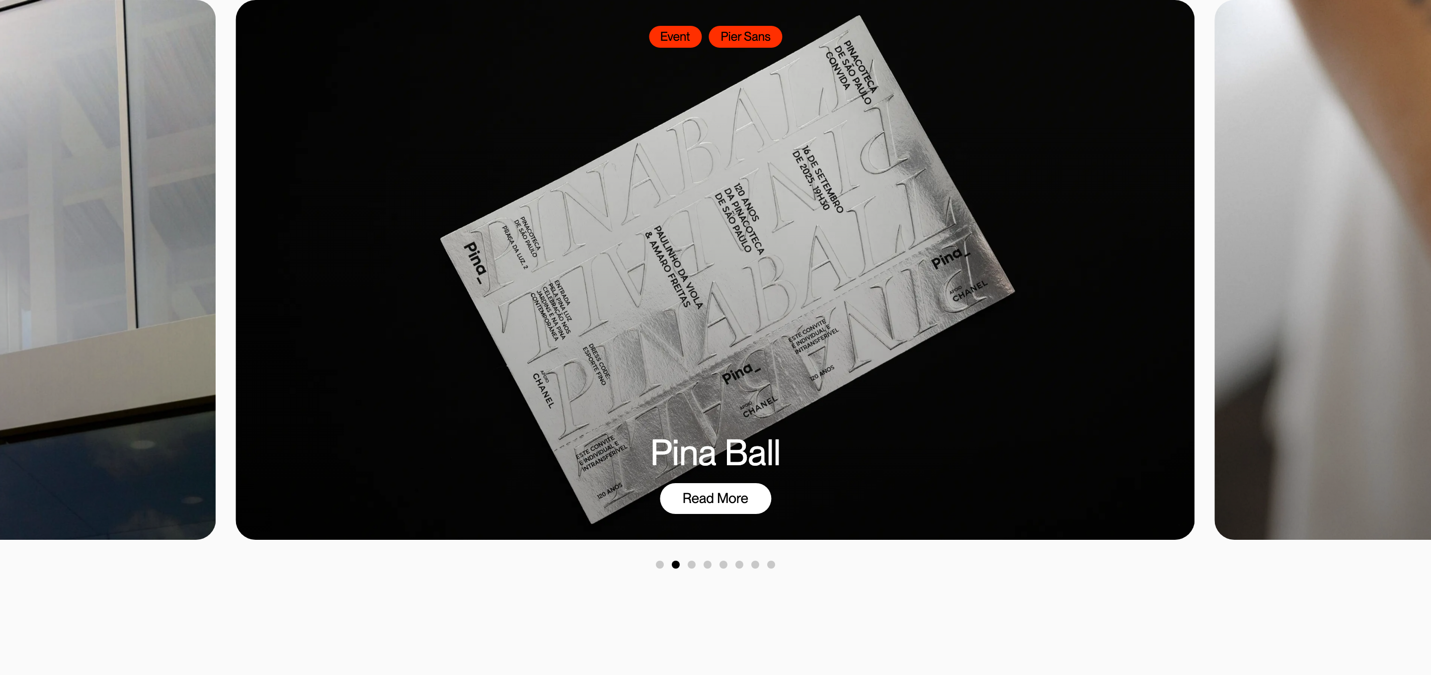 A sleek dark carousel card presenting embossed silver foil print design with vibrant orange tag accents.