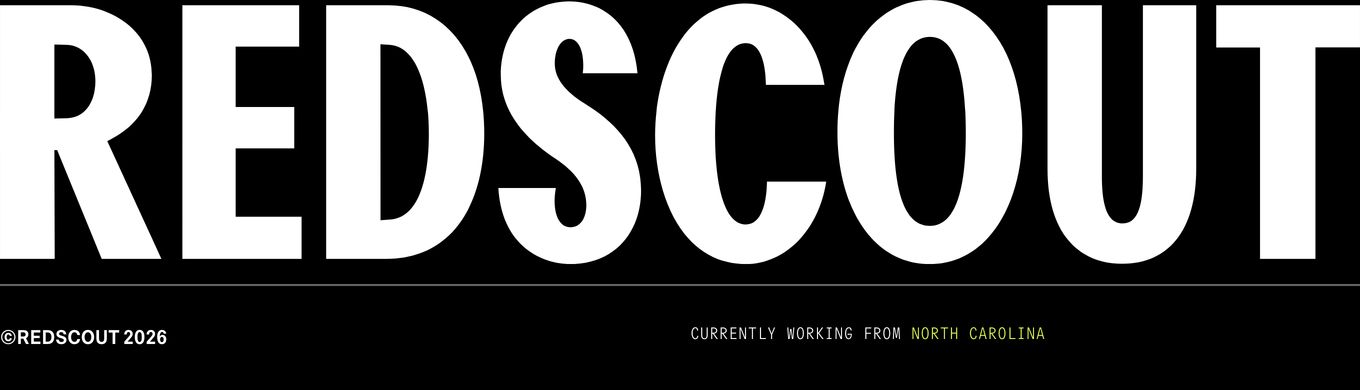Massive edge-to-edge typography dominates a minimalist black footer grounded by fine-print metadata.