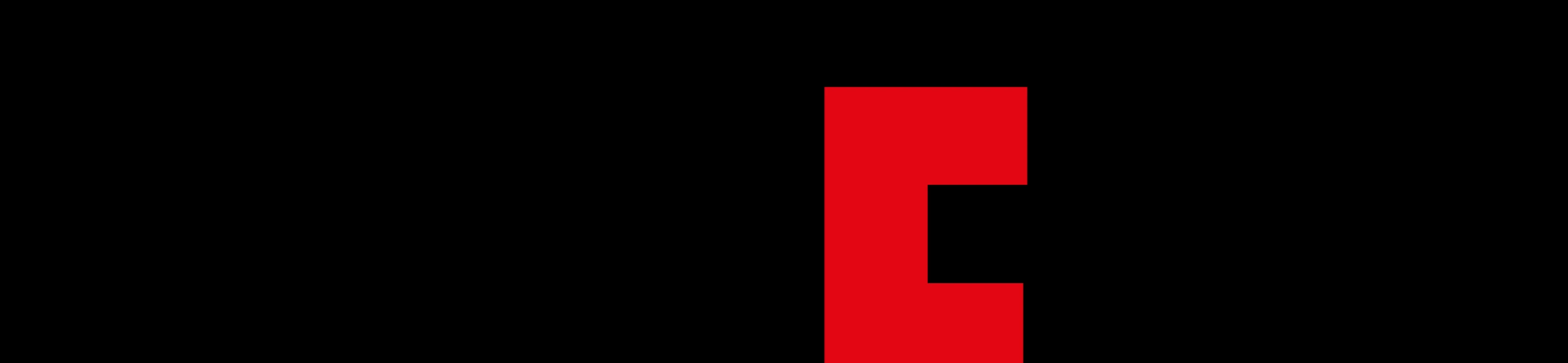 A stark brutalist void punctuated by a striking, monolithic red geometric glyph.