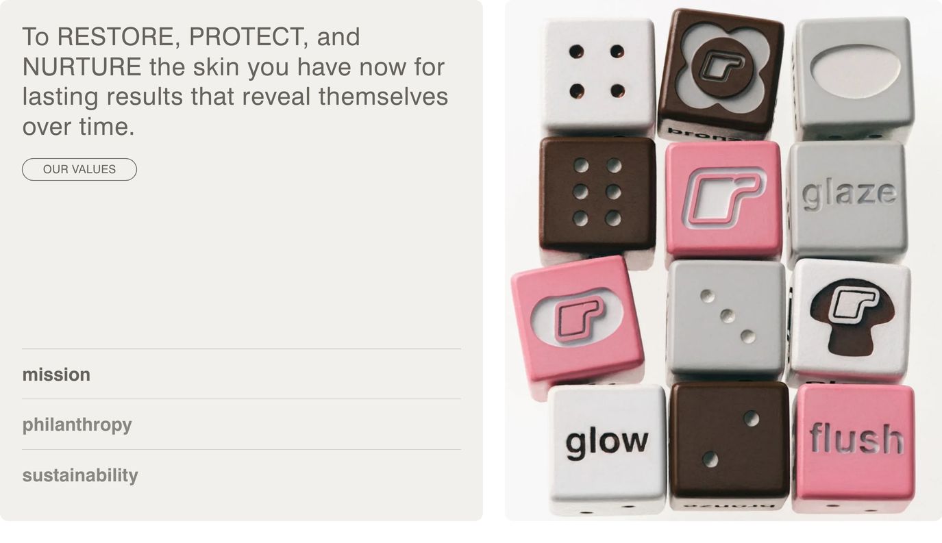 Softly muted values section pairing warm neutral typography and interactive tabs with playful, tactile branded product dice.
