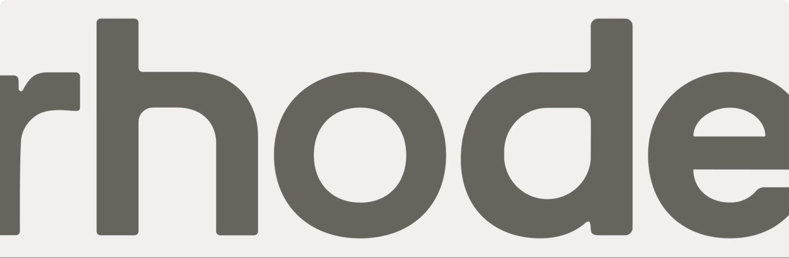 A gigantic, muted grey brand wordmark bleeding past the frame on a soft warm off-white canvas.