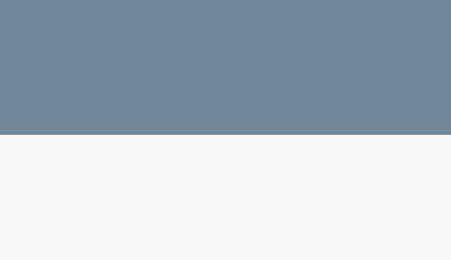A silent, minimal horizontal split of muted slate blue and clean off-white acting as a structural section divider.