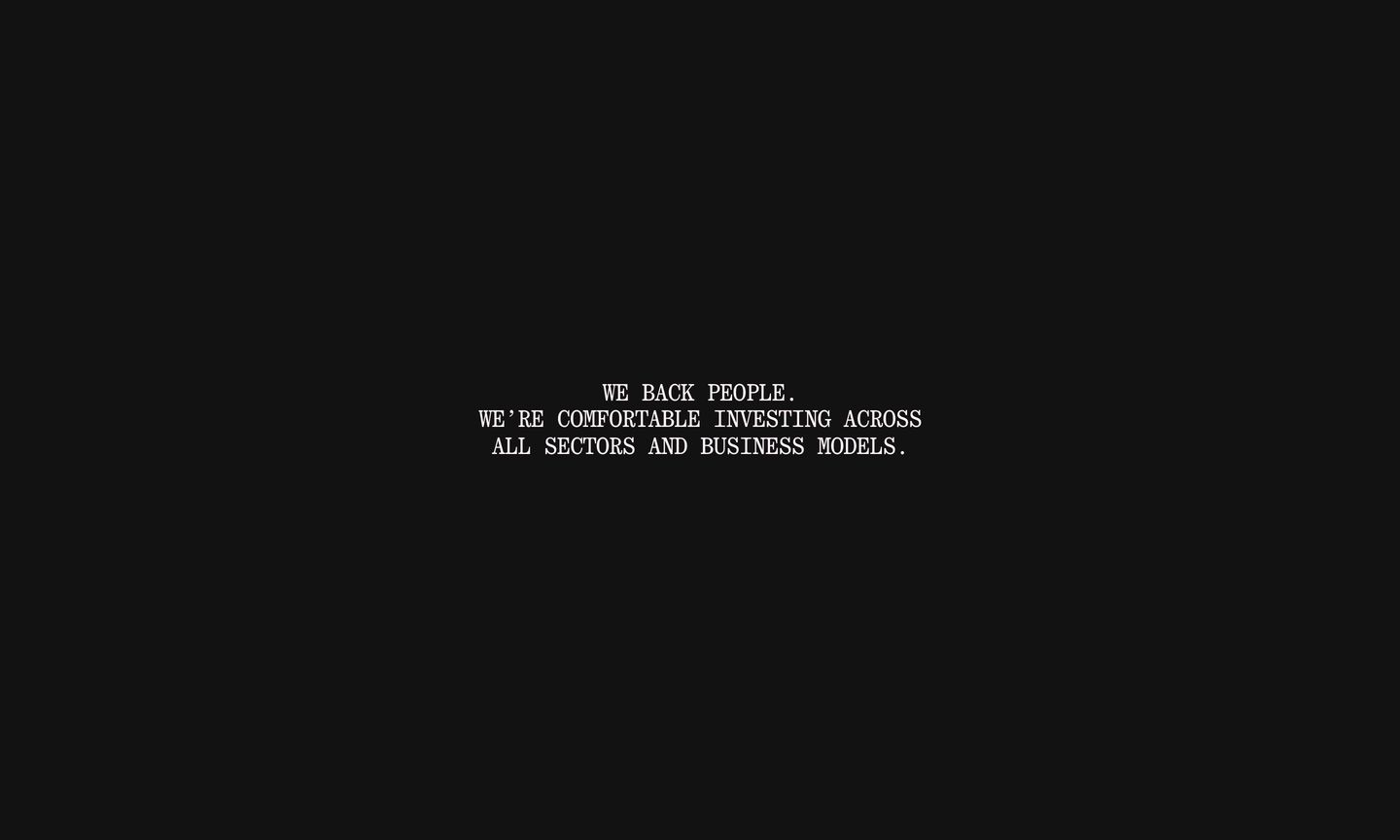 A vast black void holding a quiet, centered monospace manifesto with radical negative space.
