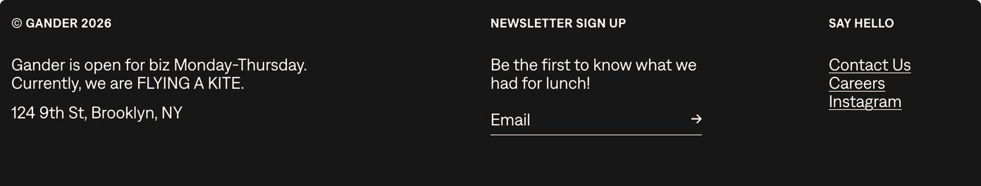 A clean dark three-column footer balancing crisp utilitarian typography with cheeky agency microcopy and a minimal newsletter input.