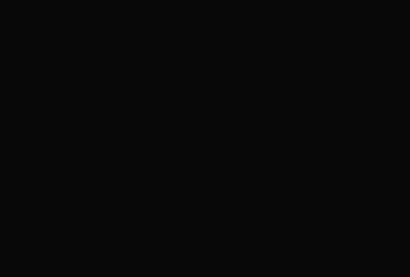 An austere full-bleed dark video section holding silent space without visible text or interface elements.