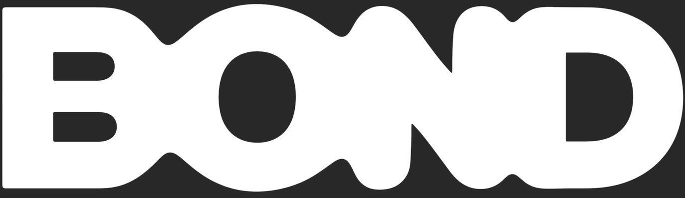 A monolithic, tactile typographic wordmark dominates the dark frame in stark, high-contrast black and white.