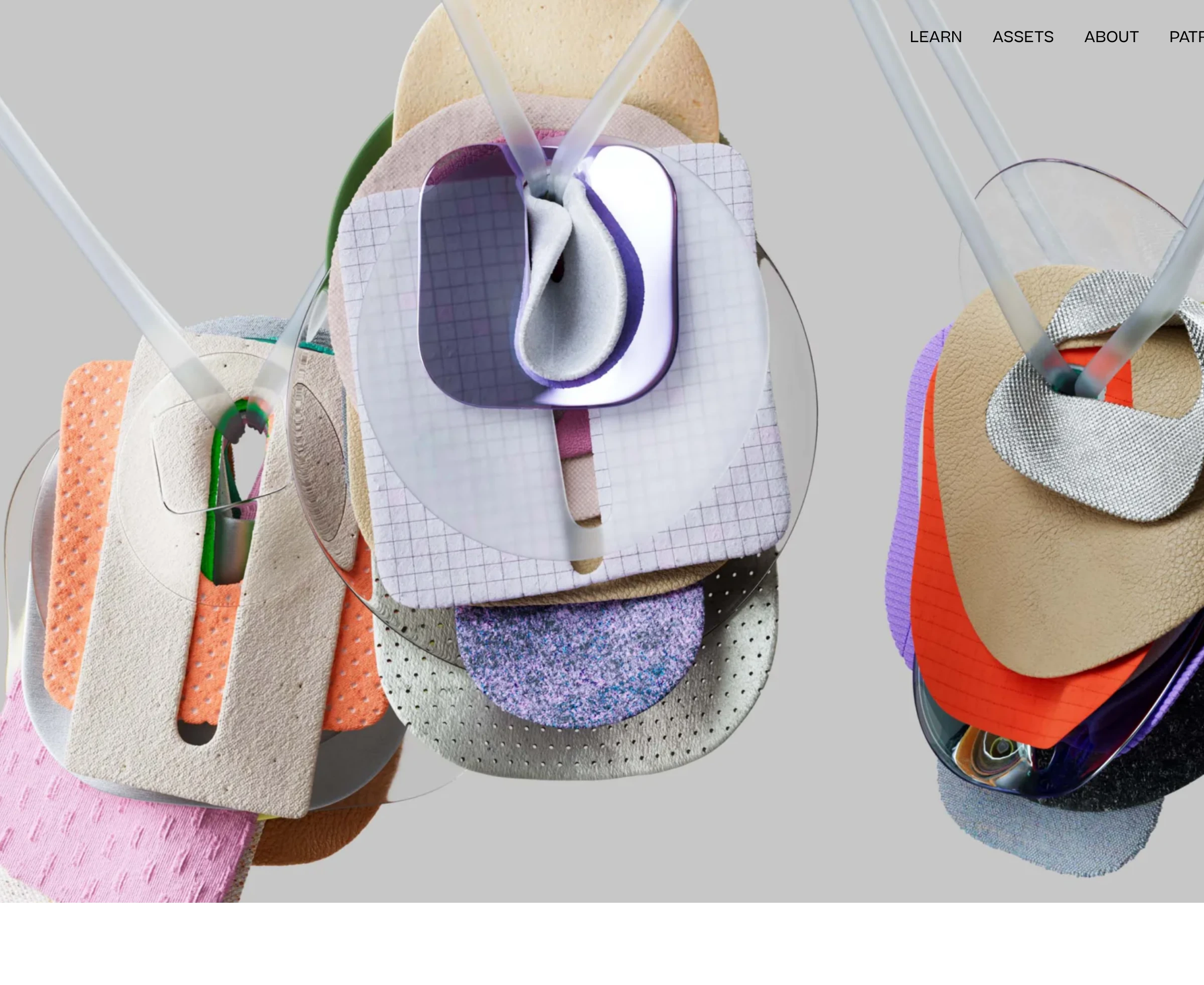 Tactile gallery-like hero featuring suspended material swatches and minimal top-right uppercase navigation.