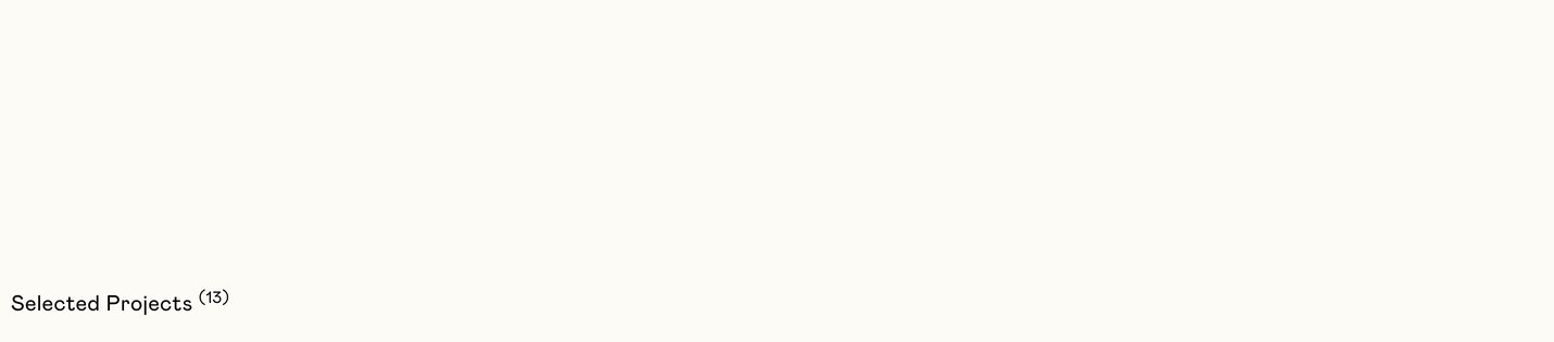 An expanse of warm white space punctuated only by a solitary, understated project index marker in the corner.
