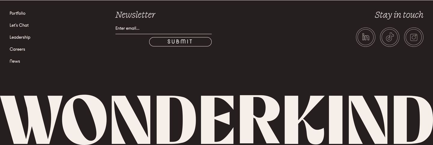 Dark, refined editorial footer anchored by a massive typographic wordmark spanning the lower border.