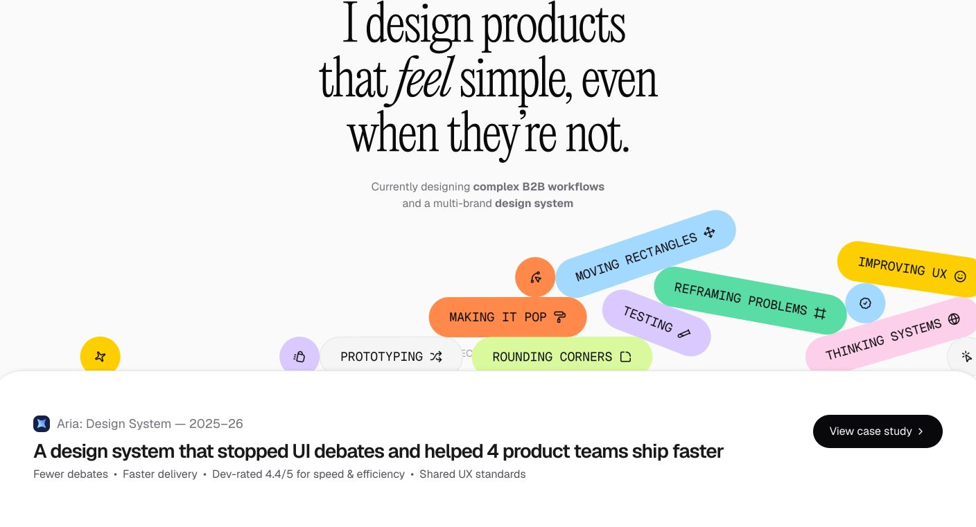 Refined portfolio hero pairing an elegant serif headline with a scattered, colorful cluster of self-deprecating design pill tags.